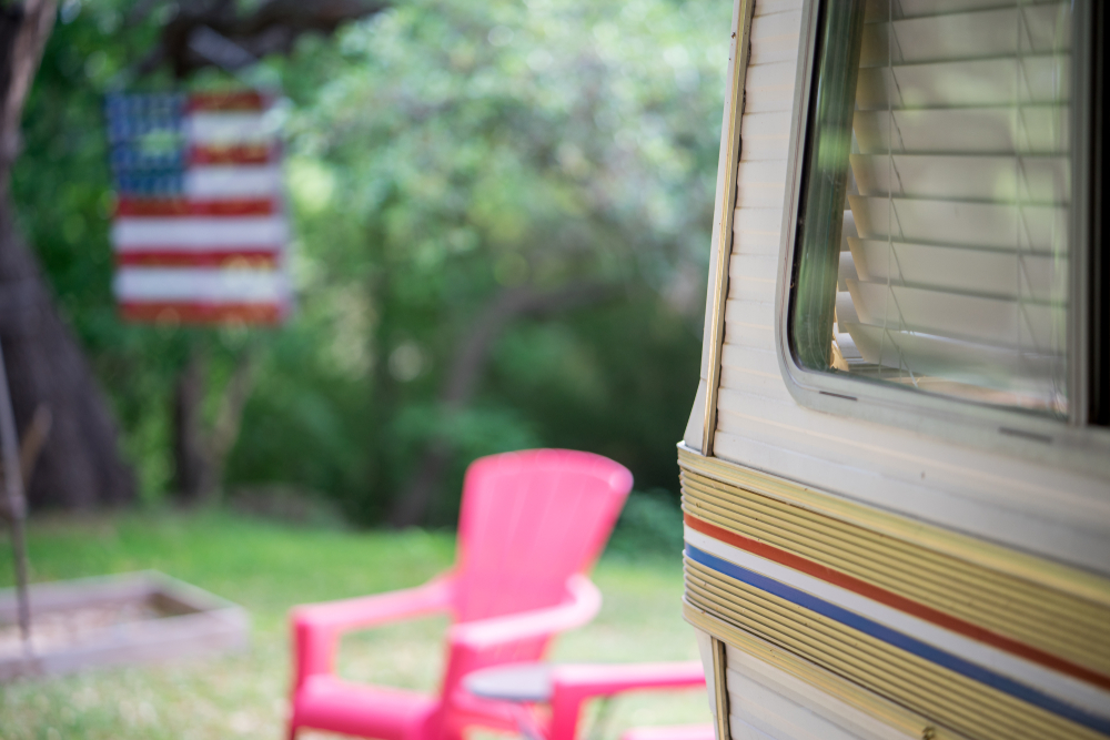 RV in a Texas campground with red lawn chairs