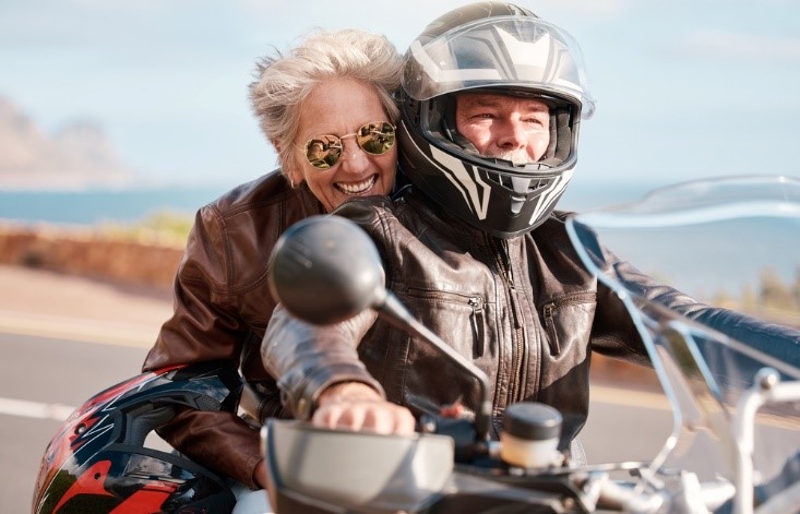 cute old couple on motorcycle in leather jackets
